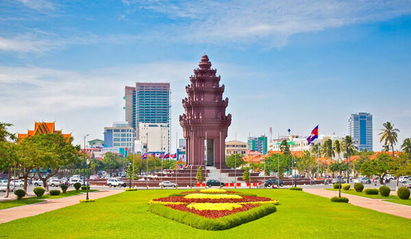 The Independence Monument standing in its flower beds on a Phnom Penh boulevard