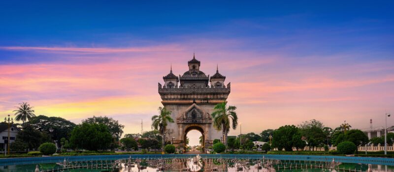 The Patuxai monument lit at twilight in Vientiane