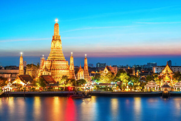 Wat Arun lit above the Chao Phraya River in Bangkok at night