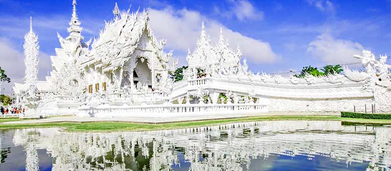 The all-white halls and bridge of Wat Rong Khun outside Chiang Rai
